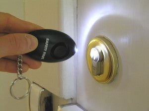 Protective alarm on the key ring with LED lamp